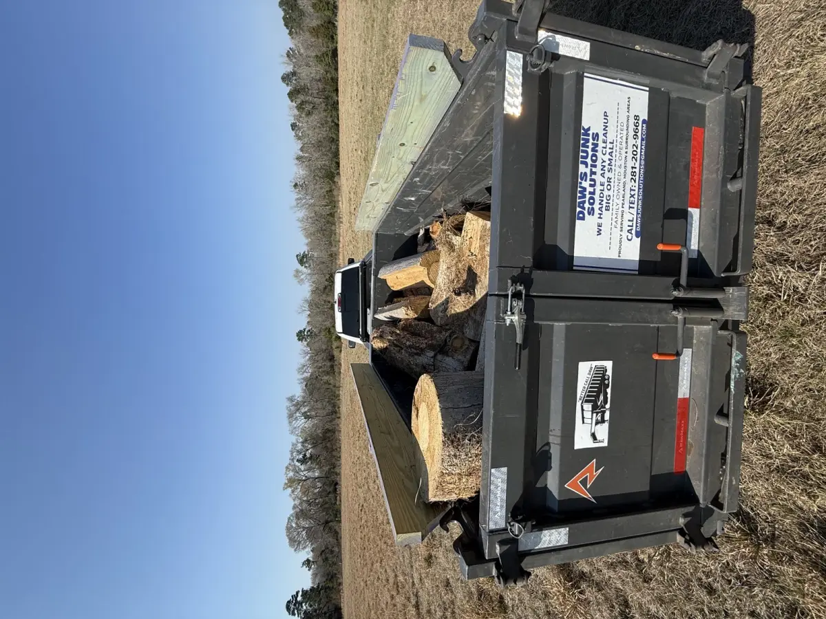 Yard waste and tree debris removal, Daw's RawMaxx trailer loaded with logs